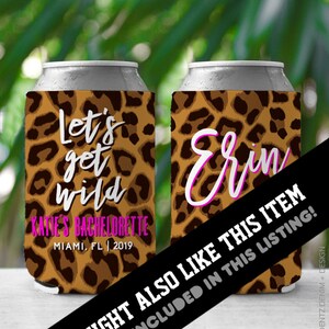 May include: Two leopard print can coolers. One cooler says "Let's get wild Katie's Bachelorette Miami, FL | 2019". The other cooler says "Erin".