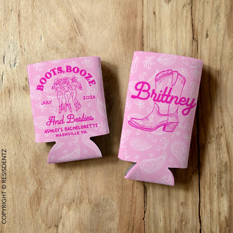 May include: Two pink can coolers with a paisley pattern. One cooler has a pink boot with the name "Brittney" and the other cooler has a pink graphic of three women in boots with the text "Boots, Booze, July 2026, And Besties, Ashley's Bachelorette, Nashville TN."