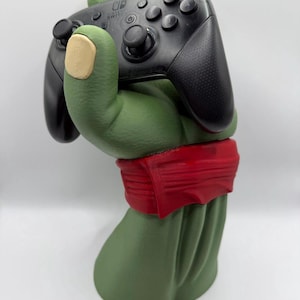 May include: A set of three ceramic mugs with a speckled, matte finish. The mugs are in shades of cream, light gray, and dark gray. Each mug has a simple, minimalist design, perfect for coffee or tea.