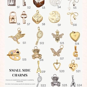 May include: A collection of small side charms in gold and silver tones. The charms include a lock, key, dice, tennis racket, bee, butterfly, heart, teddy bear, and letter charms. The text "SMALL SIDE CHARMS" is also present.
