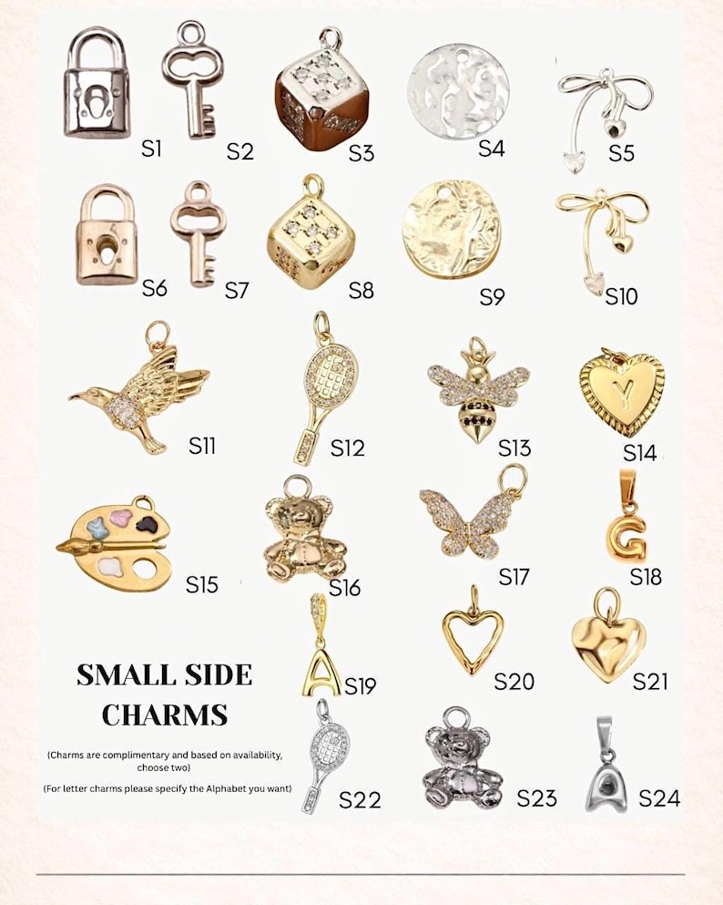 May include: A collection of small side charms in gold and silver tones. The charms include a lock, key, dice, tennis racket, bee, butterfly, heart, teddy bear, and letter charms. The text "SMALL SIDE CHARMS" is also present.