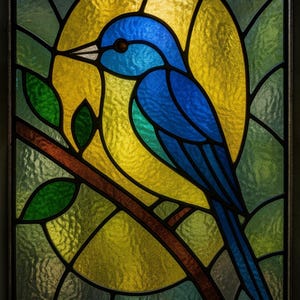 May include: Stained glass artwork depicting a blue bird on a brown branch with green leaves. The bird is set against a yellow background, with a surrounding design of green and yellow glass. The artwork is framed with black lines.
