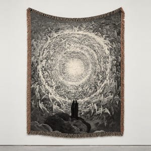 May include: A woven tapestry blanket featuring a monochromatic black and white illustration of two figures standing before a vast, swirling celestial vortex filled with winged beings, finished with a fringed edge and brown border.