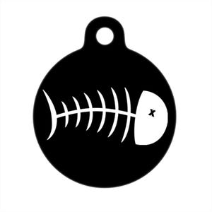 May include: Black and white pet tag with a fish bone design. The fish bone is white and the tag is black.