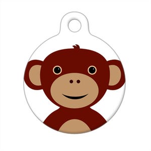 May include: A brown monkey face with a big smile, brown ears, and brown eyes. The monkey is on a white background.