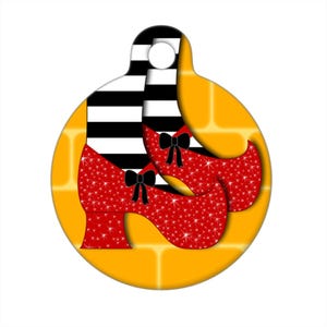 May include: Red glitter shoes with black bows and black and white striped stockings on a yellow brick road background.