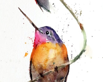 May include: Watercolor painting of three hummingbirds perched on a branch. The birds are painted in shades of blue, green, red, orange, and brown. The background is a white watercolor wash with splatters of color.