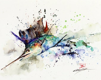 May include: Watercolor painting of a sailfish in shades of blue, green, and purple, with a long, pointed bill. The artwork features a splash effect with black and green paint splatters on a white background. Signed by the artist.