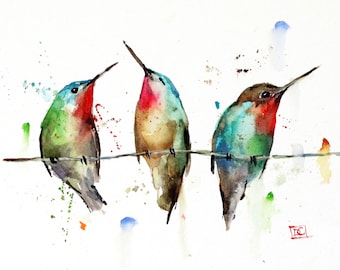 May include: Three watercolor hummingbirds perched on a wire. The birds are painted in shades of green, blue, brown, and red. The background is a white wash with splatters of color.