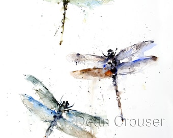 May include: Watercolor painting of three dragonflies in flight. The dragonflies are painted in shades of blue, green, and brown. The painting is signed "Dean Crouser" in the bottom right corner.