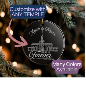 May include: Black round ornament with a gold string, featuring a temple illustration and the words "Maycie & Bryan Forever 09.30.25 MT. TIMPANOGOS TEMPLE." Text at the top says "Customize with ANY TEMPLE." The bottom text says "Many Colors Available."