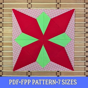 Peut inclure: Un bloc de tissu carré avec un motif d'éclat d'étoile rouge et des accents verts, sur un fond rose à pois. Le texte "PDF FPP PATTERN 7 SIZES" est affiché en bas. Idéal pour le patchwork ou l'artisanat.