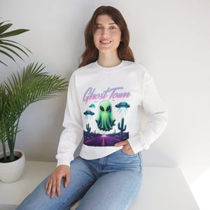 Ghost Town Alien Unisex Crewneck Sweatshirt, Cozy Alien Sweatshirt, Gift for Sci-fi Lovers, Retro Glow-in-the-Dark Sweater, Halloween [...]