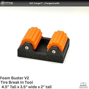 May include: Black and orange tire break-in tool. The tool has two orange rollers and a black base. The text "Foam Buster V2" and "Tire Break In Tool" is visible. The tool is 4.5 inches tall, 3.5 inches wide, and 2 inches tall.