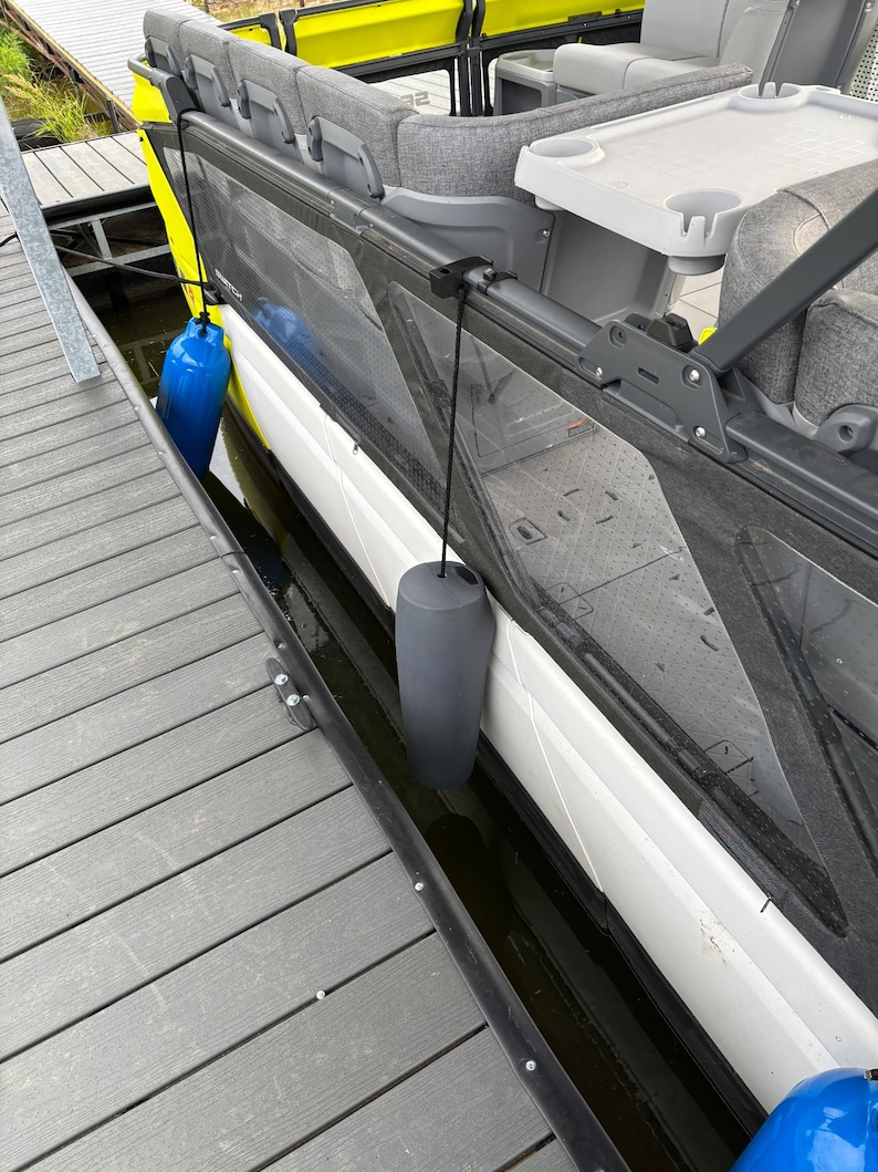 Bumper clipped to rail with custom clip.