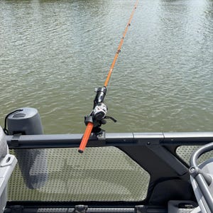 Fishing pole mounted to SEADOO SWITCH rail with LBW 2-peg mount.