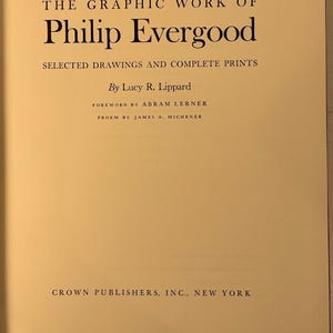 May include: Open book with a cream-colored page featuring the title "THE GRAPHIC WORK OF Philip Evergood" in black text. Below, it reads "SELECTED DRAWINGS AND COMPLETE PRINTS." The author is Lucy R. Lippard. Published by Crown Publishers, Inc., New York.