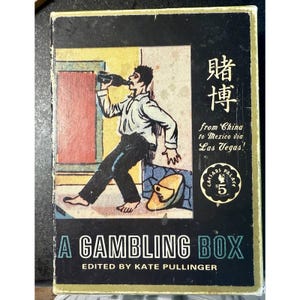 Cofanetto vintage "A Gambling Box" a cura di Kate Pullinger, con copertina rigida e inserti di gioco.