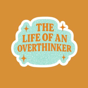 May include: A sticker with the text "THE LIFE OF AN OVERTHINKER" in orange, set against a light blue speckled cloud shape with a white border. Four orange starbursts are placed around the cloud, all on an orange background.