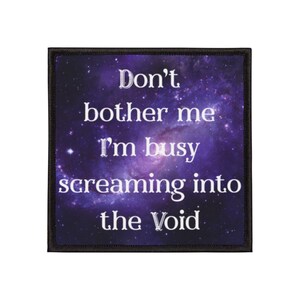 May include: Square patch with a black border. The design features a purple galaxy background with white text that reads "Don't bother me I'm busy screaming into the Void."