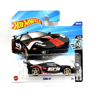 May include: A black and red Ford GT Hot Wheels die-cast toy car on a blue and white card. The car has gold wheels and the text "borla exhaust" on the side. The card reads "FORD GT" and "159/250".