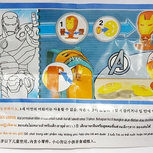 Puede incluir: Un paquete colorido con Iron Man de los Vengadores de Marvel. El paquete incluye ilustraciones de Iron Man, instrucciones de montaje y el logotipo de los Vengadores. El paquete tambi&eacute;n tiene texto en varios idiomas.