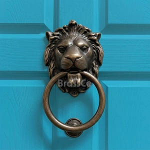 Heurtoir de porte lion avec anneau, laiton antique