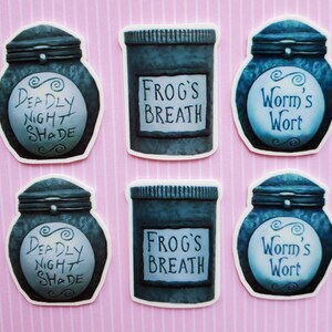 May include: Six round stickers featuring jars with different labels. The labels read "Deadly Night Shade", "Frog's Breath", and "Worm's Wort".