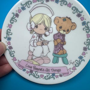 Vintage Precious Moments Collector’s Plate – “Love Beareth All Things” (1992) | Nurse & Teddy Bear