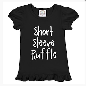 May include: Black short-sleeve ruffle shirt with white text that reads "Short Sleeve Ruffle".