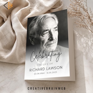 May include: A folded memorial card with a black and white portrait of an older man. The card reads "Celebrating the Life of Richard Lawson 10.08.1960 - 11.01.2025" in elegant script. The website "creativebrainweb" is at the bottom.