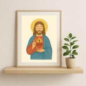 May include: Framed religious art print featuring a depiction of Jesus with a golden halo. He is wearing a blue robe and holding a flaming heart. The artwork is displayed on a wooden shelf with a small potted plant.