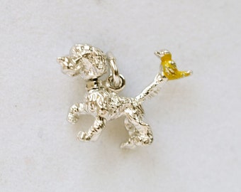 Sterling Silver dog charm with movable head & enamel yellow bird on tail, "Peanuts" style
