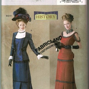 May include: A vintage sewing pattern for two women's dresses. The pattern is for sizes 12, 14, and 16. The dresses are both long and have a fitted bodice and a full skirt. The dress on the left is blue and the dress on the right is red. The pattern is from Butterick and is called "Making History".