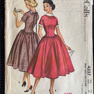 May include: Vintage McCall's sewing pattern for a dress, size 12, bust 32 inches. The pattern is for a misses' dress, easy to sew. The pattern shows two women wearing the dress, one in a red dress and one in a plaid dress.