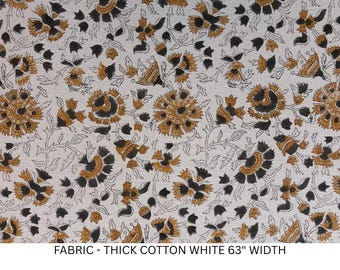 May include: A white cotton fabric featuring a repeating floral pattern in shades of dark brown and mustard yellow. The textile displays intricate botanical motifs with stylized blossoms and leaves. The text FABRIC - THICK COTTON WHITE 63" WIDTH is visible.