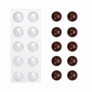 May include: A clear plastic rectangular mold tray featuring ten hemispherical cavities arranged in two columns, accompanied by ten smooth, dark brown spherical objects positioned in two vertical rows to the right of the mold tray.