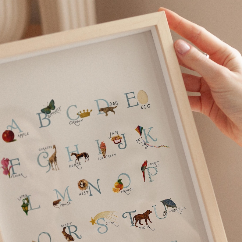 Close-up style view of the vintage nursery abc poster featuring letter details and soft muted tones, designed to feel timeless and cozy. A sweet alphabet chart for a cottagecore nursery or sage green nursery, great for nursery wall art and wall art kids rooms. Works as playroom wall art, playroom wall decor, abcs decor, and alphabet poster.