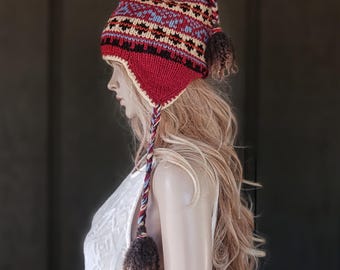 Hand knit 100% wool ear flap hat with braids and tassels lined with microfleece