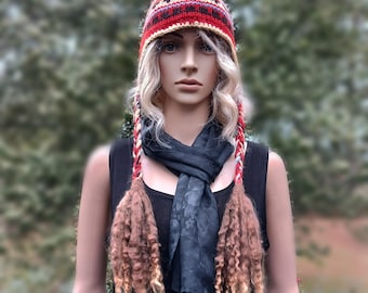 Hand knit 100% wool ear flap hat with braids and tassels lined with microfleece