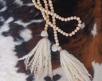Natural wooden beaded swag garland with wool tassels