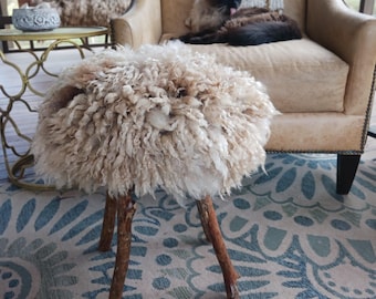 Hand crafted round wood footstool or ottoman with felted sheep wool cushioned top