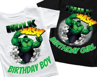 May include: Two t-shirts, one white and one black, with a Hulk graphic breaking through a wall. The text "Hulk Smash!" is above the Hulk, and "Birthday Boy" and "Birthday Girl" are below in green.