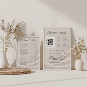 May include: Two framed signs with text, one titled "Services Pricelist" and the other "Payment Method" with a QR code. The signs are displayed with decorative vases and dried flowers. The overall aesthetic is neutral and minimalist.