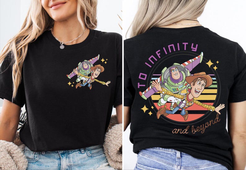 May include: Black t-shirt featuring a cartoon graphic of Buzz Lightyear and Woody from Toy Story. The front has a small image of the characters, while the back displays a larger design with the text "TO INFINITY and beyond."