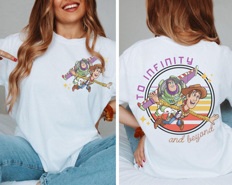 May include: White t-shirt featuring a colorful graphic of Buzz Lightyear and Woody from Toy Story. The front has a small image of the characters, while the back displays a larger image with the text "TO INFINITY and beyond."