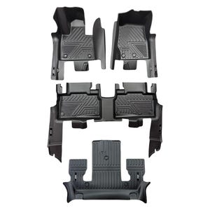 May include: A set of black car floor mats. The mats are moulded with a textured surface and a geometric pattern. They have raised edges to contain spills. The set includes mats for the front and back rows of the vehicle.