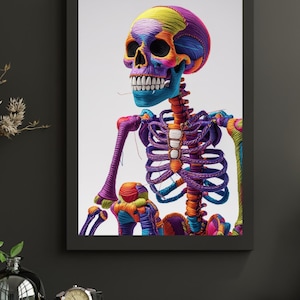 以下が含まれることがあります： カラフルで様式化された骸骨を描いた額入りのアートワーク。頭蓋骨は黄色、紫、青の混合色で、肋骨と手足は鮮やかな紫、オレンジ、緑色です。アートワークは白い背景に設定されています。