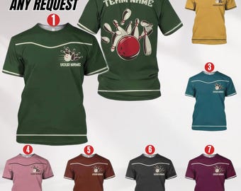 May include: Bowling-themed t-shirts in various colors, including green, gold, teal, pink, brown, gray, and burgundy. Each shirt features a bowling pin and ball graphic, with options for custom text. The shirts have white trim and are short-sleeved.