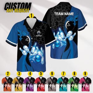 May include: Bowling-themed button-up shirt with a blue and black design featuring bowling pins and a ball. The shirt has short sleeves with white trim and the text "CUSTOM ANY REQUEST" at the top. Additional color options are displayed below.
